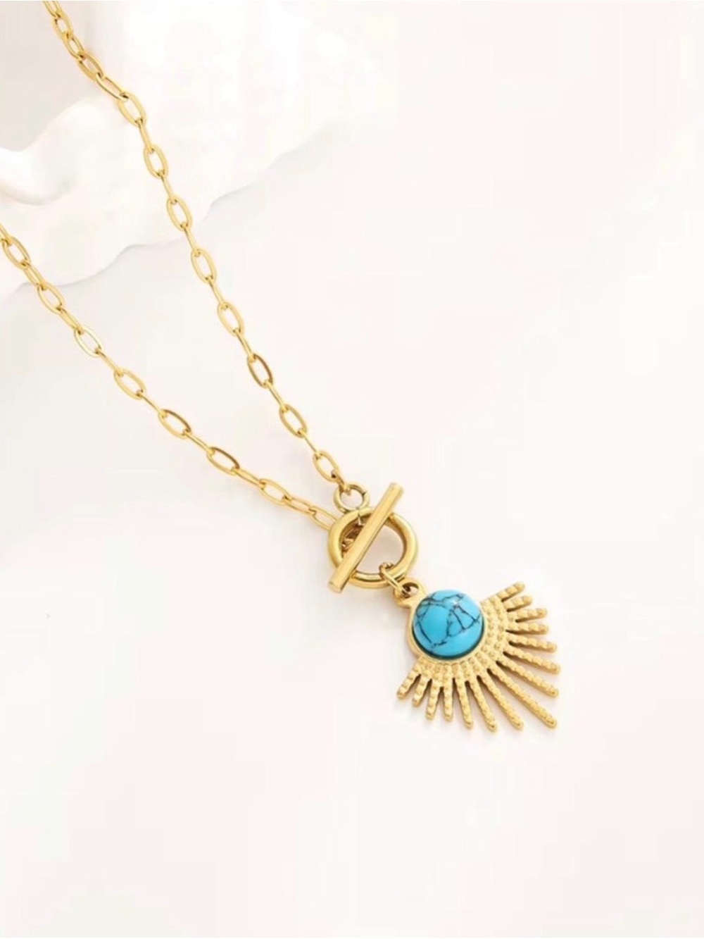 Gold Sunburst Pendant Necklace with Turquoise Stone